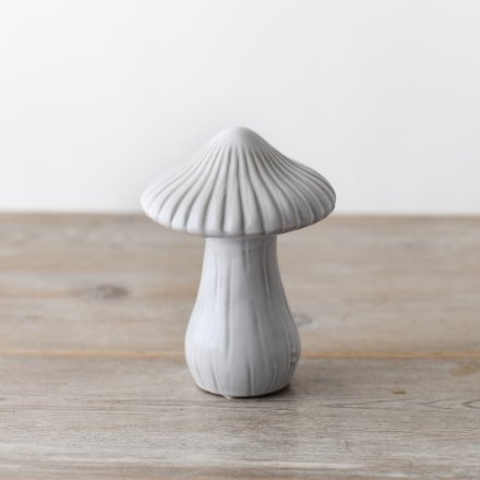 A enchantingly whimsical mushroom with a reactive glaze finish