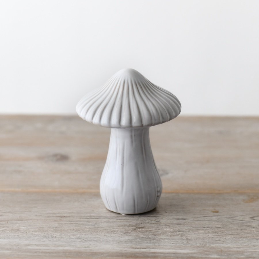 An enchantingly whimsical mushroom boasting a reactive glaze finish