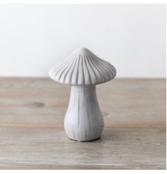 A charmingly whimsical mushroom adorned with a reactive glaze finish