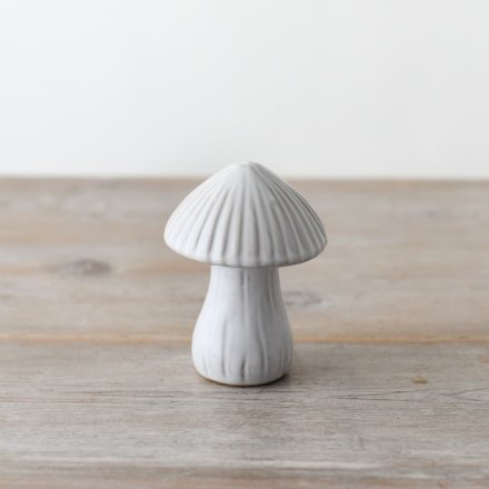 A delightful ceramic mushroom ornament with whimsical reactive glazing