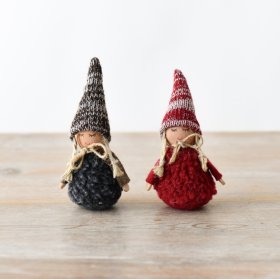 A sweet assortment of two charming fabric dolls in brown and white hues.