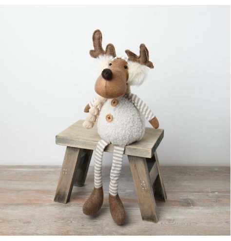 A charming plush moose decoration featuring dangling legs and adorned with a cosy white sherpa body