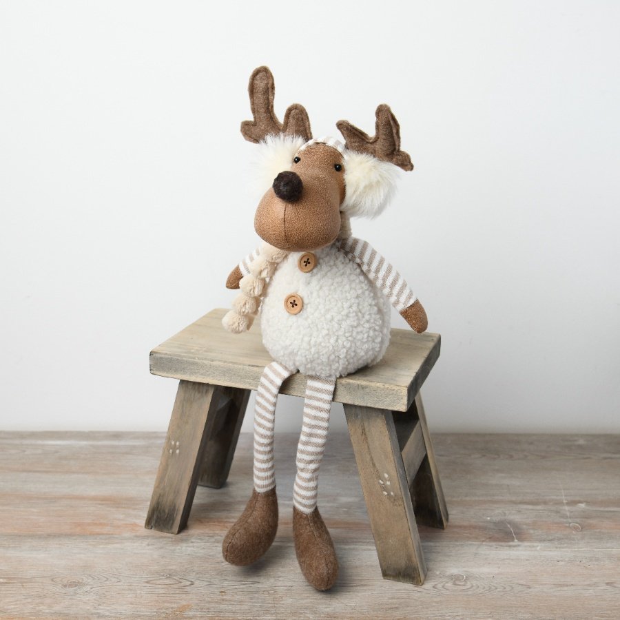 A charming plush moose decoration featuring a white sherpa body, brown accents, and adorable fluffy earmuffs.