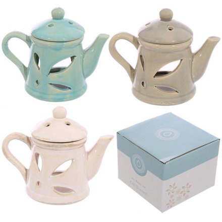 A shabby chic oil burner in the shape of a teapot in 3 assorted designs. 