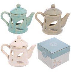 A shabby chic oil burner in the shape of a teapot in 3 assorted designs. 