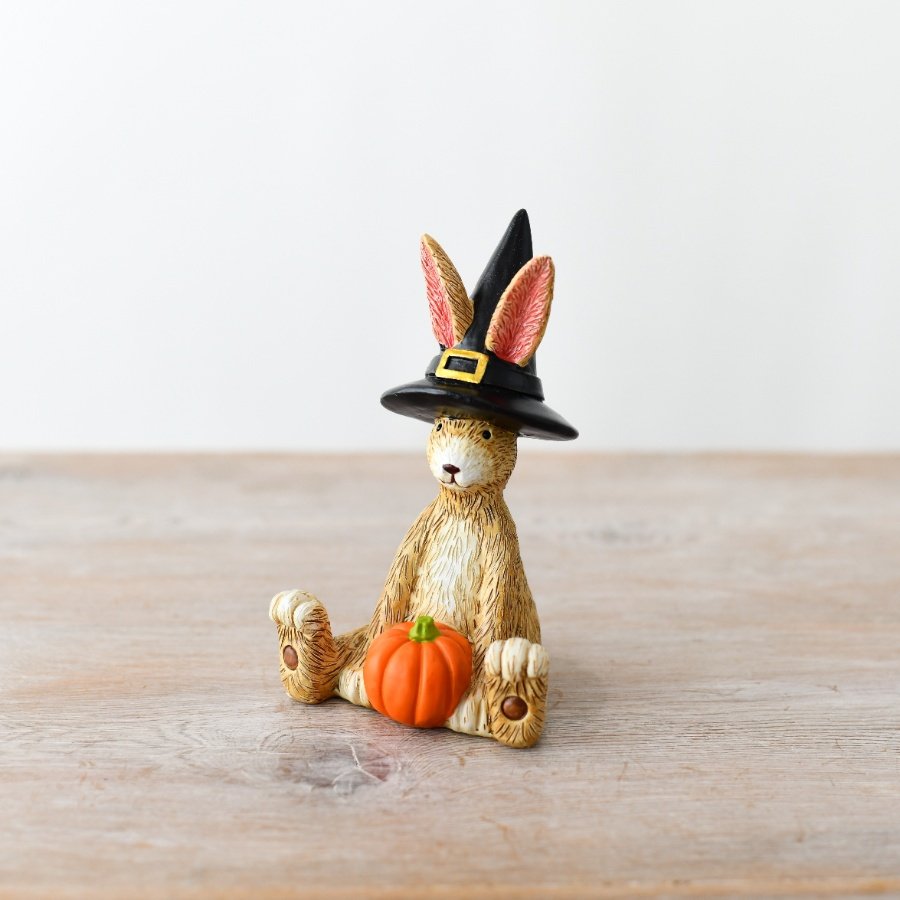 This witch bunny comes equipped with a witch's hat and an adorable pumpkin companion
