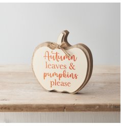 A charming and unique wooden sign in the shape of a pumpkin. 
