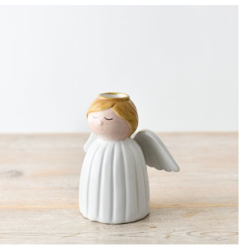 "Cherish your loved ones with an angel-themed candle holder."