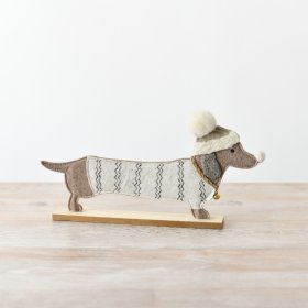 A charming felt dachshund ornament, featuring a winter jumper and bobble hat