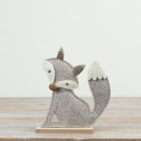 Add a touch of minimalist charm to any room with this felt fox featuring neutral tones.