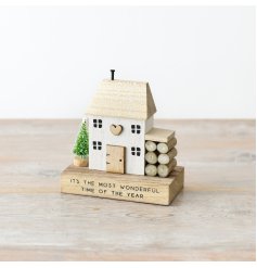 Festive Wooden House Block with Firewood