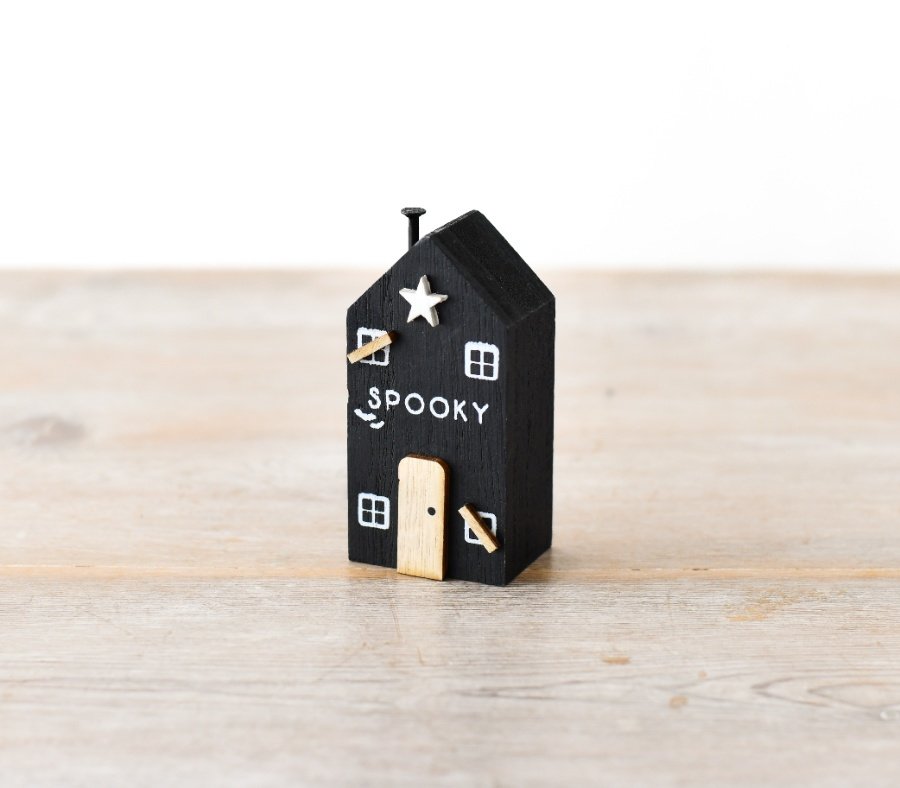 A must have seasonal gift and decoration. A beautifully crafted wooden house with unique dainty details and SPOOKY sign