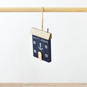 Add a touch of coastal charm to your space with the Salty Kisses Coastal Wooden House 