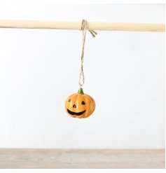 Get into the Halloween spirit with this cheerful pumpkin decor featuring a smiley face!