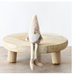 A charming natural tone themed gonk with long legs for sitting 