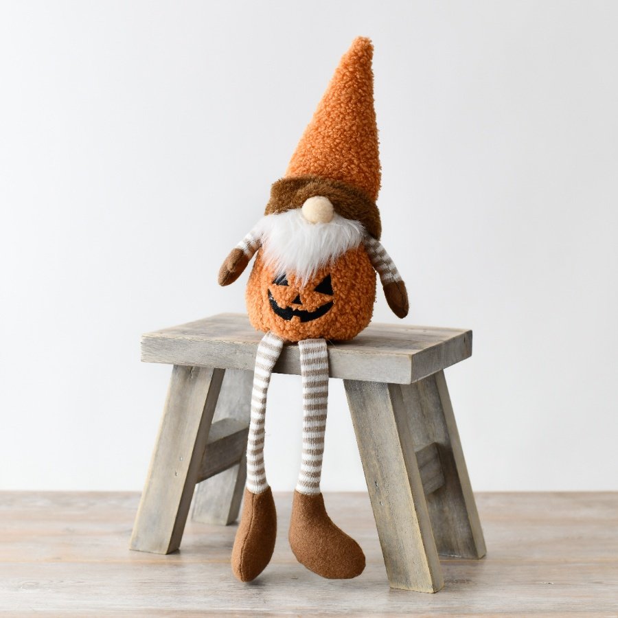 Discover our unique Fabric Santa with a delightful pumpkin face and festive legs, perfect for adding a touch of charm 