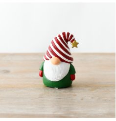 A charming gonk decoration with a candy cane hat and gold star detail.