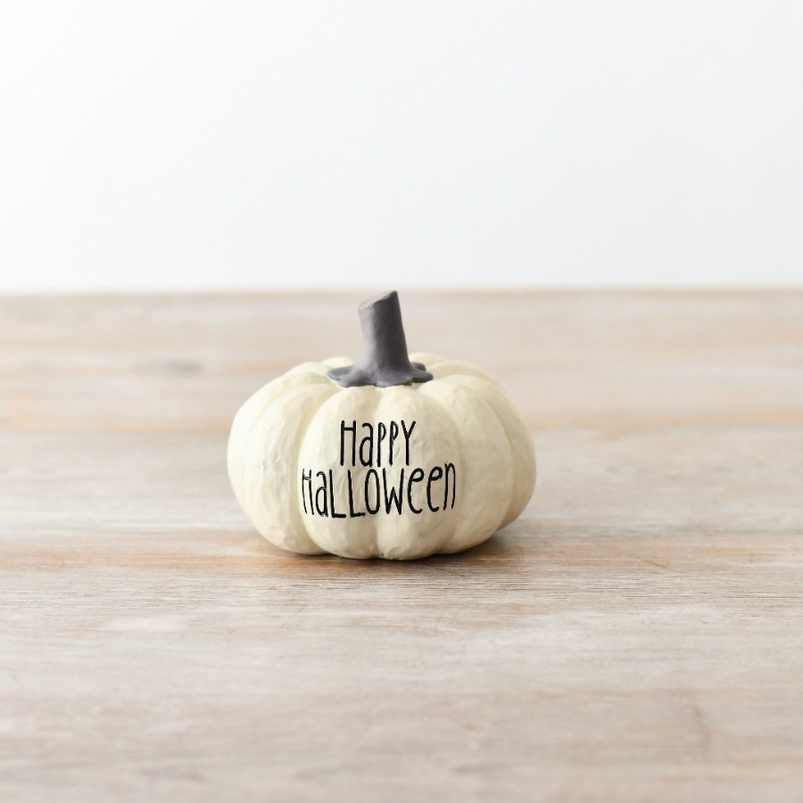 A charming white pumpkin decoration adorned with the phrase 'Happy Halloween' elegantly engraved in black text.