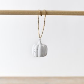 An adorable white ceramic pumpkin decoration complete with a jute string hanger.