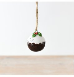 A delightful Christmas pudding ornament with an adorable smiling face,