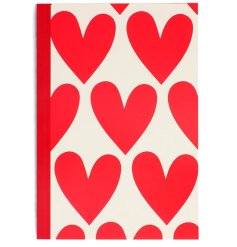 A lined A5 notebook with a heart pattern on the front and back. 