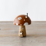 A unique and beautifully crafted wooden mushroom ornament with 3D details and a painted finish. 
