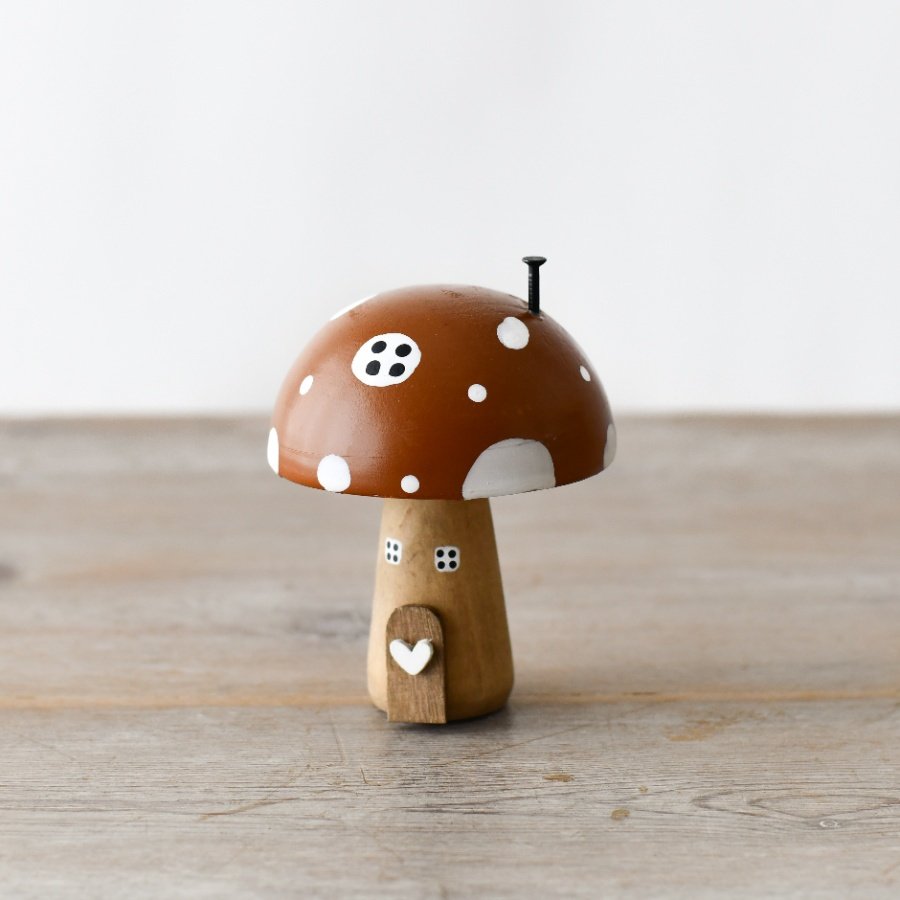 A beautifully crafted and enchanting wooden mushroom house. Complete with 3D features and charming painted details. 