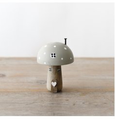 An enchanting wooden mushroom house. Decorated with hand painted details and charming 3D features.