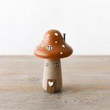 A wonderful and whimsical wooden mushroom house with hand painted details and 3D features. 
