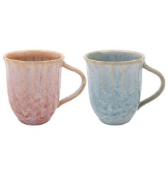Set of two mugs, each mug features a unique, handcrafted reactive glaze finish in vibrant coral and deep blue tones