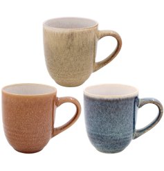 A beautiful assortment of three mugs showcasing an elegant reactive glaze finish.