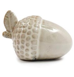 Bring a touch of autumn beauty indoors with this ceramic acorn decoration