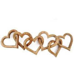 a rustic heart decoration made up of 6 wooden hearts. 