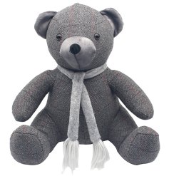 Bring some character and practicality to your home with the Teddy doorstop with a scarf.