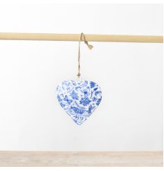 A chic metal hanging heart with a blue hare design. An intricate pattern with flora and fauna. 