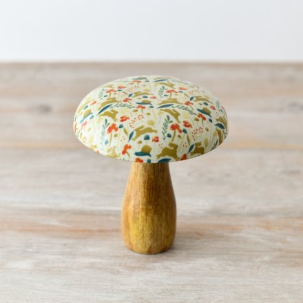 A colourful spring mushroom with a whimsical woodland design with jumping rabbits. 