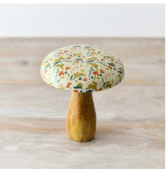 A beautifully crafted mushroom ornament with a natural mango wood base and enamel cap. 