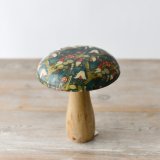 A stylish and unique wooden mushroom with a highly decorated enamel cap. 