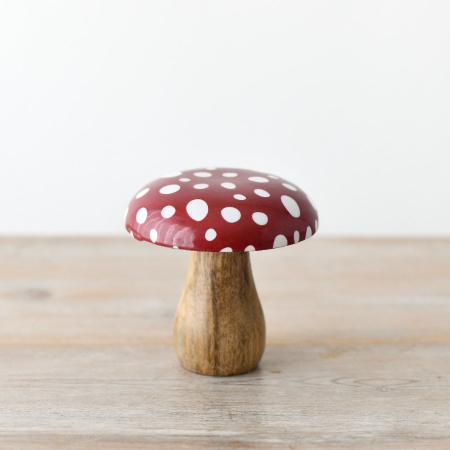 A whimsical woodland ornament made from natural mango wood with an enamel cap. 