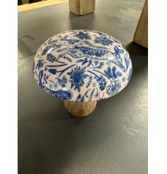 This wooden mushroom with enamel cap is a unique interior accessory for the home.