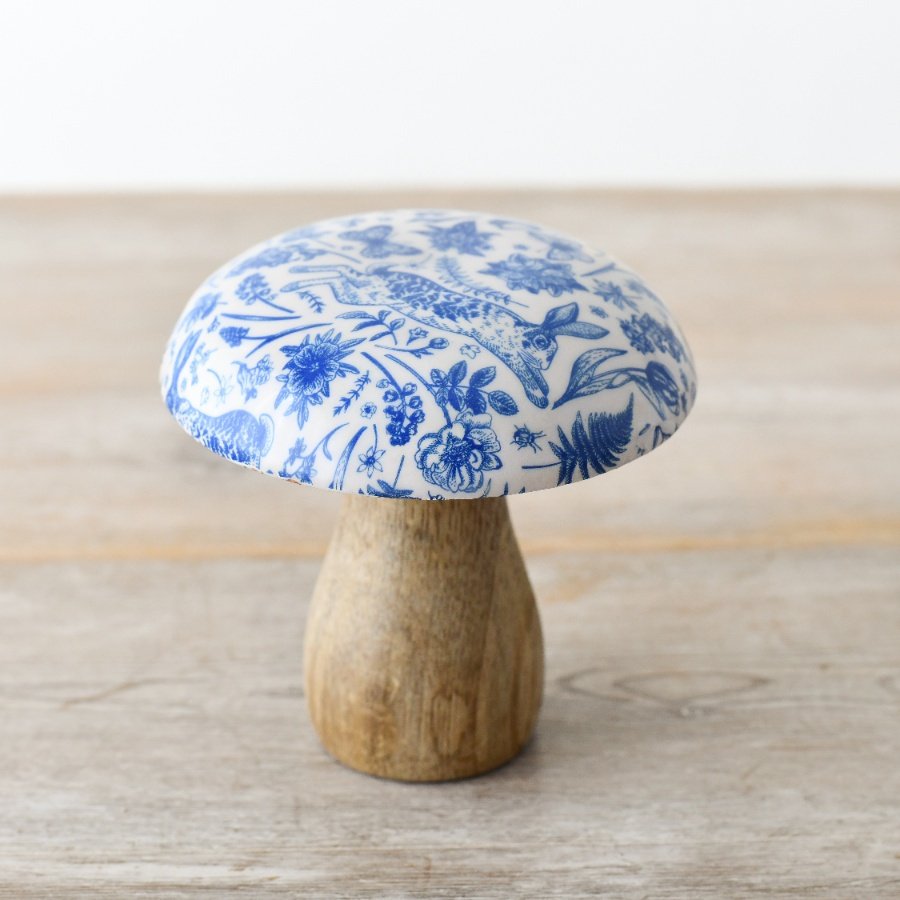 Adorn the home with this enchanting wooden mushroom ornament. Made from a chunky natural wood with an enamel cap. 