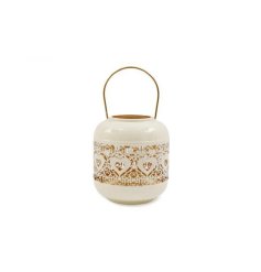 A charming cut out lantern ideal for indoor and outdoor decoration.