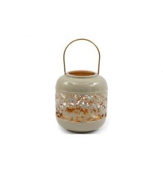 This boho style lantern is the perfect accessory for adding a rustic feel to your home.
