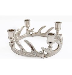 A chrome candle holder featuring 4 candle holes, in an antler design.