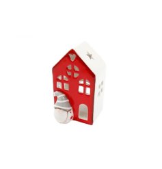 Bring a cozy feel to your home this festive season with this house tealight holder.