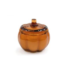 Cozy up this autumn with this orange glass candle pot. 
