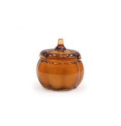 This stunning glass pumpkin candle pot captures the essence of autumn.