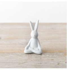 Add texture to your seasonal displays with this unique sitting yoga rabbit. 