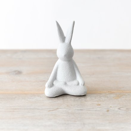 A chic contemporary rabbit decoration in a sitting yoga pose. A textured ornament for the home.