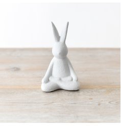 A chic contemporary rabbit decoration in a sitting yoga pose. A textured ornament for the home.